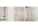 Hallway with white walls leading to bedrooms and bathrooms. with carpet floors at 12105 Conrad Cir, Hampton, GA 30228
