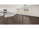 Bright living room with recessed lighting, wood-look floors, and a view of the kitchen, offers a welcoming atmosphere at 12105 Conrad Cir, Hampton, GA 30228