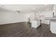 Expansive living space with an open kitchen, stairs, and ample room, perfect for Gathering and entertaining guests at 12105 Conrad Cir, Hampton, GA 30228