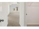 Bright carpeted main bedroom with ceiling fan, window, and walk-in closet at 12105 Conrad Cir, Hampton, GA 30228