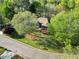 Overhead view of the property, showcasing the lush green lawn, mature trees and a long driveway at 2025 Golden Ridge Cir, Cumming, GA 30040