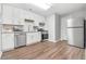Well-equipped kitchen with white cabinets, stainless steel appliances, and modern fixtures at 2025 Golden Ridge Cir, Cumming, GA 30040