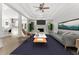 Bright living room with a fireplace and high ceilings, seamlessly connecting to the modern kitchen at 2025 Golden Ridge Cir, Cumming, GA 30040