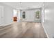 Open living room with modern wood flooring, white trim and filled with natural light at 2025 Golden Ridge Cir, Cumming, GA 30040