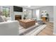 Cozy living room with a fireplace, large windows, and comfortable seating at 2025 Golden Ridge Cir, Cumming, GA 30040