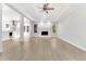 Bright and airy living room featuring a fireplace and seamless flow to the kitchen for modern living at 2025 Golden Ridge Cir, Cumming, GA 30040