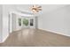 Bright main bedroom featuring a trey ceiling, ceiling fan, and large windows offering abundant natural light at 2025 Golden Ridge Cir, Cumming, GA 30040