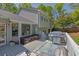 Back deck featuring an outdoor grill, seating area, and tree-lined backyard at 2775 Whippoorwill Cir, Duluth, GA 30097