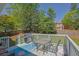 Back deck with grill, outdoor seating, and view of the backyard at 2775 Whippoorwill Cir, Duluth, GA 30097