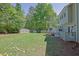 Expansive backyard with a well-maintained lawn and a deck perfect for outdoor relaxation and activities at 2775 Whippoorwill Cir, Duluth, GA 30097