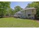 Expansive backyard featuring a well-maintained lawn, wooden fence, and a spacious deck, ideal for outdoor relaxation at 2775 Whippoorwill Cir, Duluth, GA 30097