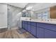 Bathroom with walk-in shower, double sinks, and stylish vanity at 2775 Whippoorwill Cir, Duluth, GA 30097
