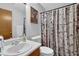 Bathroom features an updated vanity, sink, toilet, and shower/tub combo at 2775 Whippoorwill Cir, Duluth, GA 30097