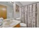 Bathroom with a vanity, toilet, and shower with a birch tree shower curtain at 2775 Whippoorwill Cir, Duluth, GA 30097