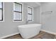 Freestanding bathtub with modern fixtures and minimalist design at 2775 Whippoorwill Cir, Duluth, GA 30097