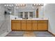Spacious bathroom features a double sink vanity, large mirror, and tiled walk-in shower at 2775 Whippoorwill Cir, Duluth, GA 30097