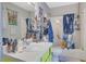 Functional bathroom with a shower-tub combo and bright yellow vanity at 2775 Whippoorwill Cir, Duluth, GA 30097