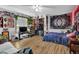 Cozy bedroom with wood floors and plenty of personal decor and bright daylight at 2775 Whippoorwill Cir, Duluth, GA 30097