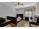 Bedroom includes hardwood floors, natural light, ceiling fan, and matching furnishings at 2775 Whippoorwill Cir, Duluth, GA 30097