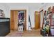 Bedroom features an open closet with shelving and hardwood floors at 2775 Whippoorwill Cir, Duluth, GA 30097
