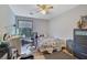 Modest bedroom with neutral walls, wood floors, and a window for natural light at 2775 Whippoorwill Cir, Duluth, GA 30097