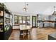 Dining Area featuring hardwood floors, bay windows with built-in seating, and access to the kitchen at 2775 Whippoorwill Cir, Duluth, GA 30097