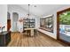 Open dining area with hardwood floors, ample storage, and a bay window with a seating area at 2775 Whippoorwill Cir, Duluth, GA 30097