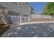 Attached two-car garage with modern doors and an ample driveway providing plenty of parking space at 2775 Whippoorwill Cir, Duluth, GA 30097
