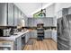 Well lit kitchen with lots of gray cabinets and stainless steel appliances at 2775 Whippoorwill Cir, Duluth, GA 30097