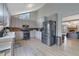 Kitchen featuring stainless steel appliances, light grey cabinets, and laminate flooring at 2775 Whippoorwill Cir, Duluth, GA 30097
