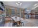 Spacious kitchen area with stainless steel appliances, light cabinets, and a breakfast nook at 2775 Whippoorwill Cir, Duluth, GA 30097