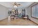 Spacious living room featuring laminate floors, with built-in bookshelves and chairs at 2775 Whippoorwill Cir, Duluth, GA 30097