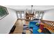 Bright living room boasts a wood-burning fireplace, hardwood floors, modern ceiling fan, and large windows at 2775 Whippoorwill Cir, Duluth, GA 30097
