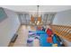 Open living room with fireplace, wood floors, and stairs to second floor at 2775 Whippoorwill Cir, Duluth, GA 30097