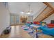 Bright living room showcasing a stone fireplace, hardwood floors, and open staircase to the second floor at 2775 Whippoorwill Cir, Duluth, GA 30097