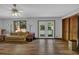 Living room featuring hardwood floors, large windows, and access to the backyard at 2775 Whippoorwill Cir, Duluth, GA 30097