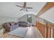 Cozy loft area with couches, hardwood floors, natural light, and a ceiling fan at 2775 Whippoorwill Cir, Duluth, GA 30097