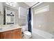 Well-lit bathroom with a vanity, toilet, bathtub and coordinated fixtures at 552 Lawton Bridge Sw Rd, Smyrna, GA 30082