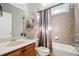 Cozy bathroom featuring neutral tile, bathtub, shower, and stylish modern art at 552 Lawton Bridge Sw Rd, Smyrna, GA 30082