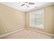 Neutral-colored bedroom with carpet, ceiling fan, and natural light from the window at 552 Lawton Bridge Sw Rd, Smyrna, GA 30082