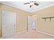 Carpeted bedroom with natural light, crown molding, and a ceiling fan at 552 Lawton Bridge Sw Rd, Smyrna, GA 30082