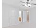 A bright bedroom features a ceiling fan, and closet doors for ample storage at 552 Lawton Bridge Sw Rd, Smyrna, GA 30082