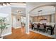 Elegant dining room with hardwood floors, modern chandelier, and access to a living space at 552 Lawton Bridge Sw Rd, Smyrna, GA 30082