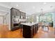 Modern kitchen with dark cabinets, stainless steel appliances, and hardwood floors at 552 Lawton Bridge Sw Rd, Smyrna, GA 30082