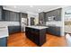 Spacious kitchen featuring dark cabinets, stainless appliances, and an island with seating at 552 Lawton Bridge Sw Rd, Smyrna, GA 30082