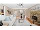 Inviting living room featuring hardwood floors, a stone fireplace, and neutral decor at 552 Lawton Bridge Sw Rd, Smyrna, GA 30082