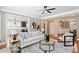 Bright living room featuring hardwood floors and open concept to kitchen and dining area at 552 Lawton Bridge Sw Rd, Smyrna, GA 30082