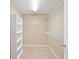 Bright walk-in closet with shelving and hanging racks for optimal storage organization at 552 Lawton Bridge Sw Rd, Smyrna, GA 30082