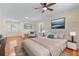 Bright main bedroom features two windows, light-colored walls, and a neutral-toned color scheme at 2350 Powers Ferry Se Dr, Marietta, GA 30067