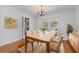 Formal dining room with hardwood floors, chandelier, and access to outdoor spaces at 2350 Powers Ferry Se Dr, Marietta, GA 30067